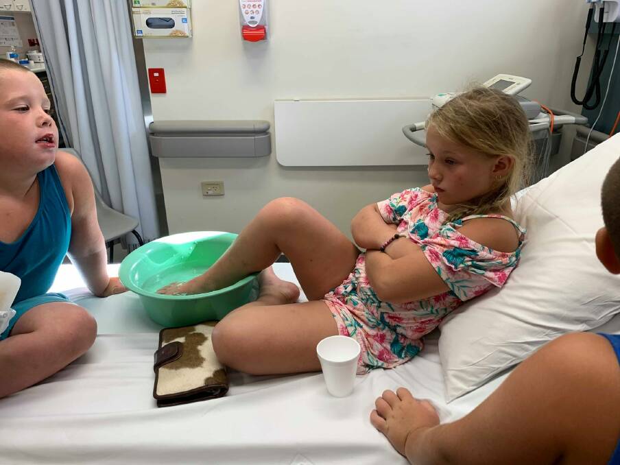 GETTING TREATMENT: Clancie Jade Townsend in hospital after she stepped on a bullrout at Koree Island.
