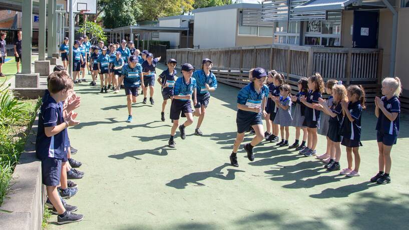 UNITED IN VICTORY: The Kayaday Club combined to run a marathon at Wauchope Public School.