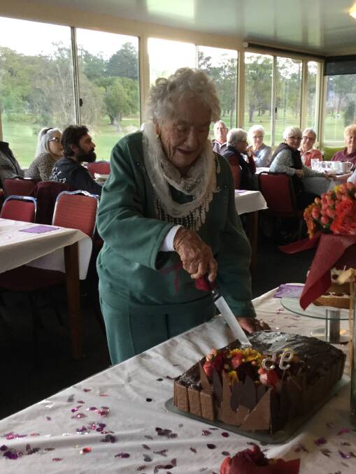 CUTTING THE CAKE: Paula Murray celebrates her 95th birthday with family and friends at Wauchope Country Club.