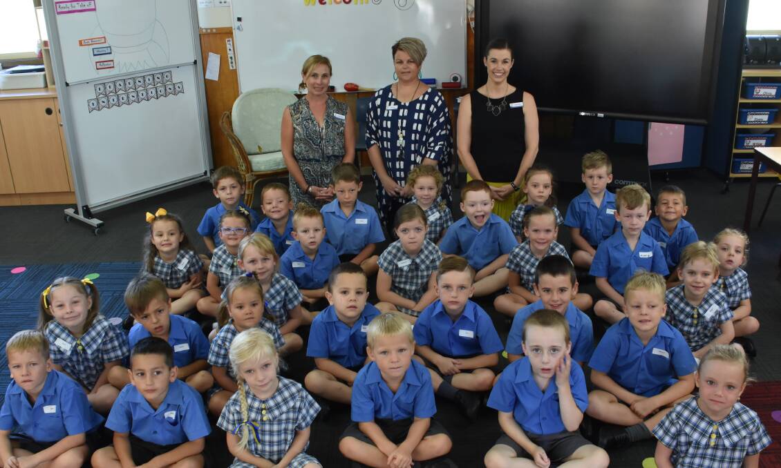 FRESH START: teacher Petrina Lewis, assistant Cherie Knox and teacher Rachel Moss with the 26 new kindies at St Joseph's Primary in Wauchope.