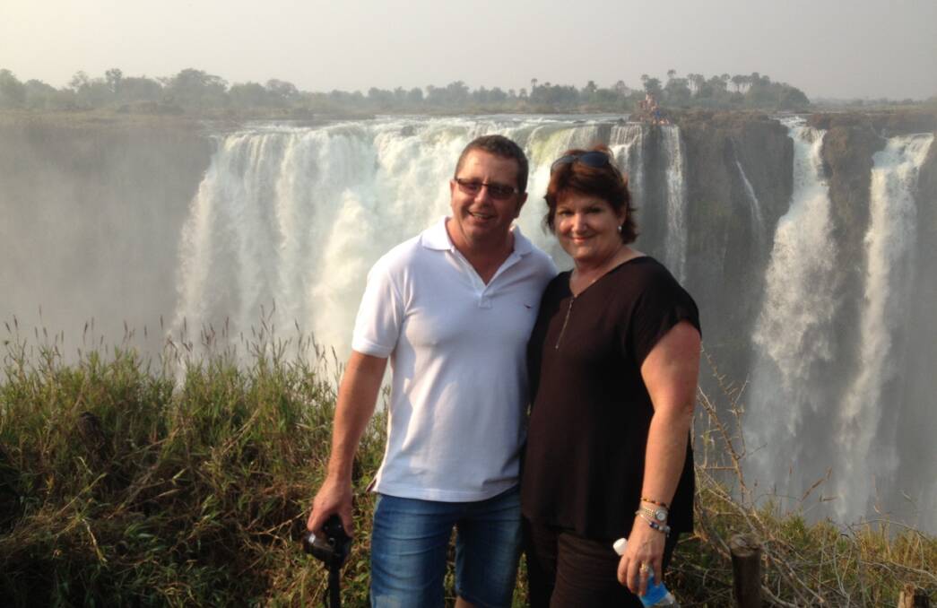 Robyn Flanagan and husband James in front of Victoria Falls on the Zambezi River at the border between Zambia and Zimbabwe.  