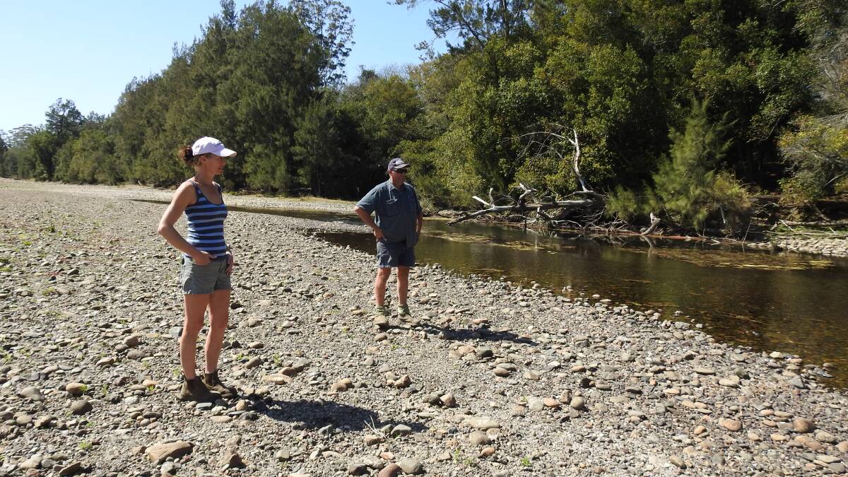 Lisa France and Craig Ford stand on the dry river bed of the Hastings River at Pipeclay which is just a stream in places.