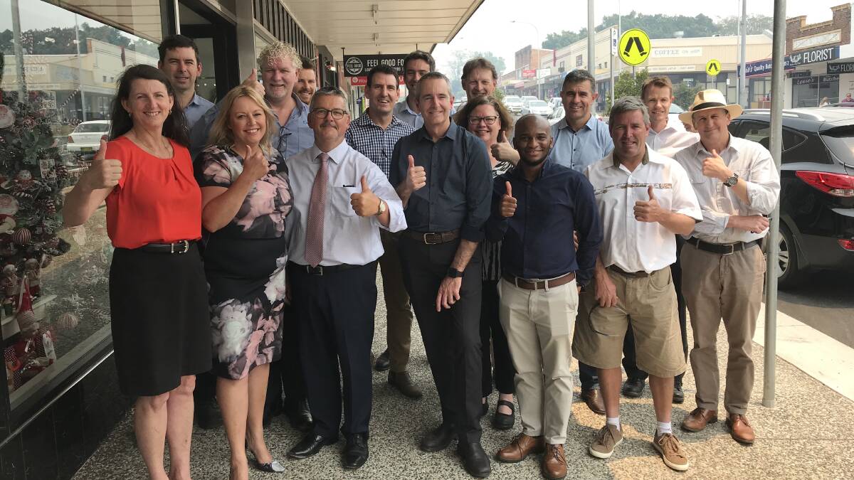 GOOD NEWS: Thumbs up from council staff, councillors and key stakeholders celebrating the upgrade of the High Street in Wauchope.
