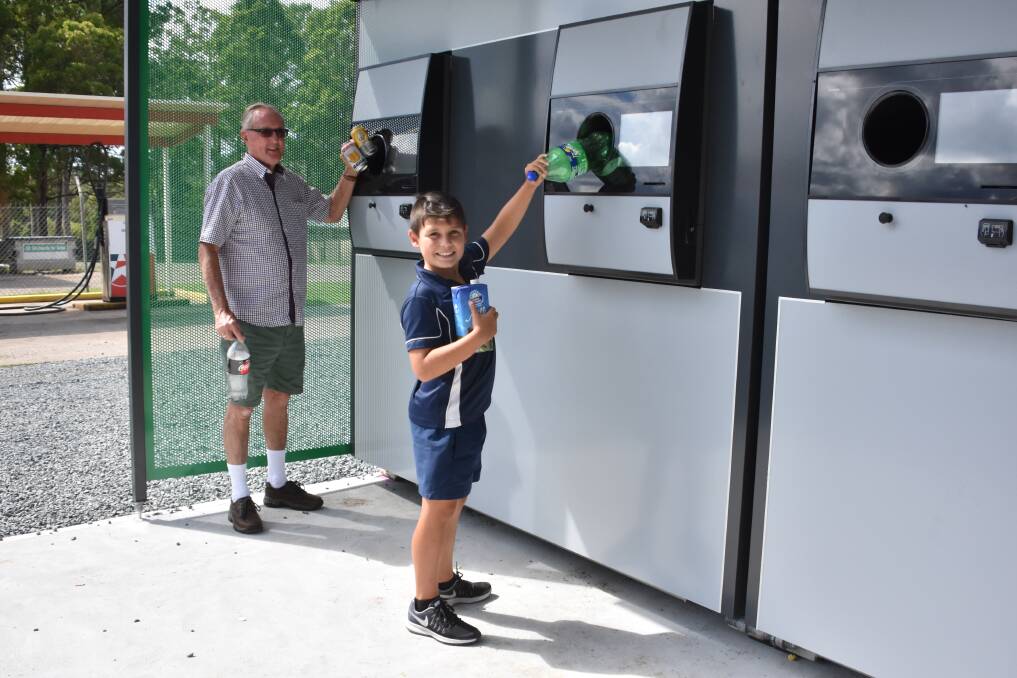 Graeme Cook and grandson Noah Langdon were among the first to use the reverse vending machines in Wauchope last year.