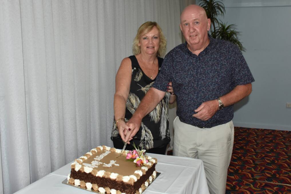 WINNING TEAM: Wife Jan Saley helps husband, Wayne, to cut his retirement cake at Wauchope RSL Club in January.  Now, he is a life member.