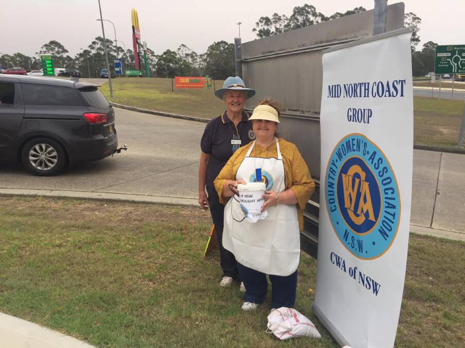 WOMEN HELPING WOMEN: CWA's Delma Robson and Sonia Bowers collect for drought and fire-affected families.