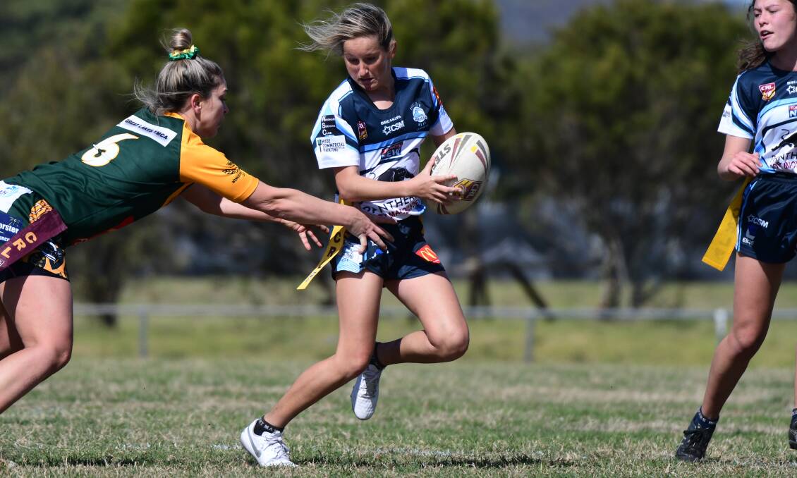 Get the tag: Sarah Stewart evades the Forster-Tuncurry defence in the major semi-final. The two sides will meet again in Sunday's Group 3 ladies league tag grand final. Photo: Paul Jobber