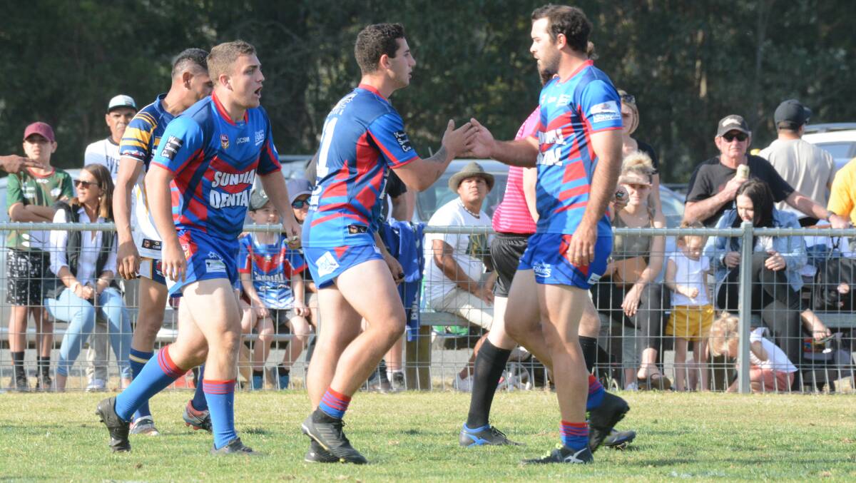 Job done: Wauchope Blues players celebrate after a try during the 2019 grand final loss to Macleay Valley.