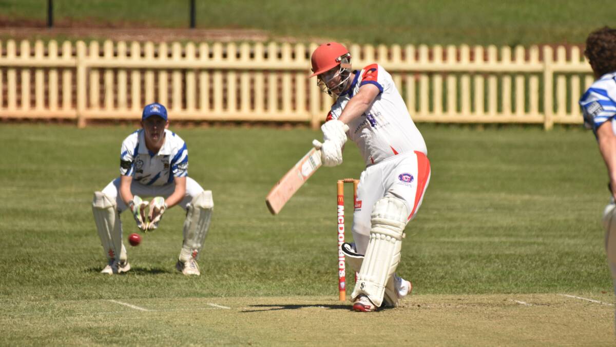 Runs there: Nathan Lyon drives through cover during his unbeaten century in Wauchope RSL's win on Saturday. Photo: Paul Jobber