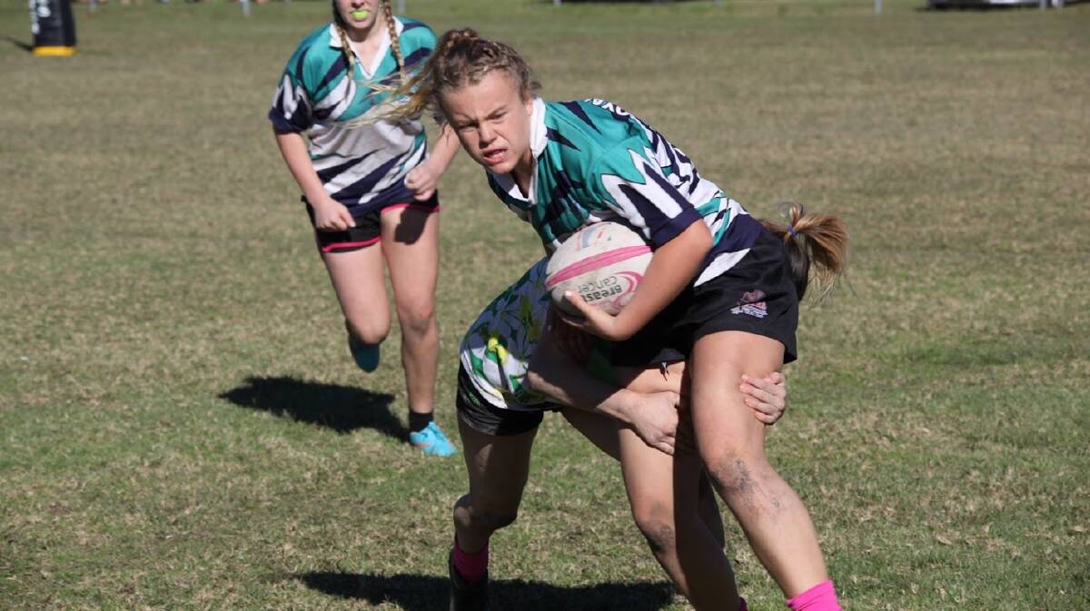 Hit and stick: Sascha Everingham in action at a recent sevens junior gala day. Photo: supplied