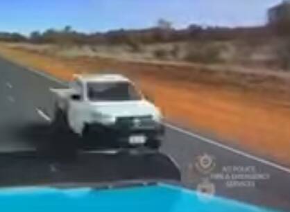 Barely on the right side of the road - with centimetres to spare. Photo: Scree grab from NT Police supplied dashcam video