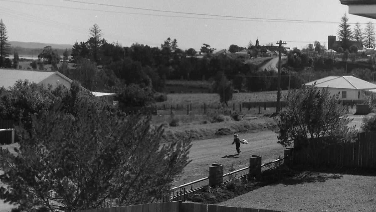 Lake Road as it was in the 1960s: A raging bushfire threatened four homes when it came within 20 feet of their back steps in 1968.