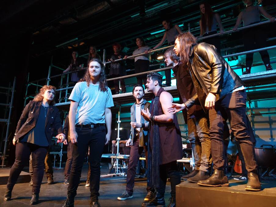Judas questions Jesus and his followers in Players Theatre's production of Jesus Christ Superstar in Concert.