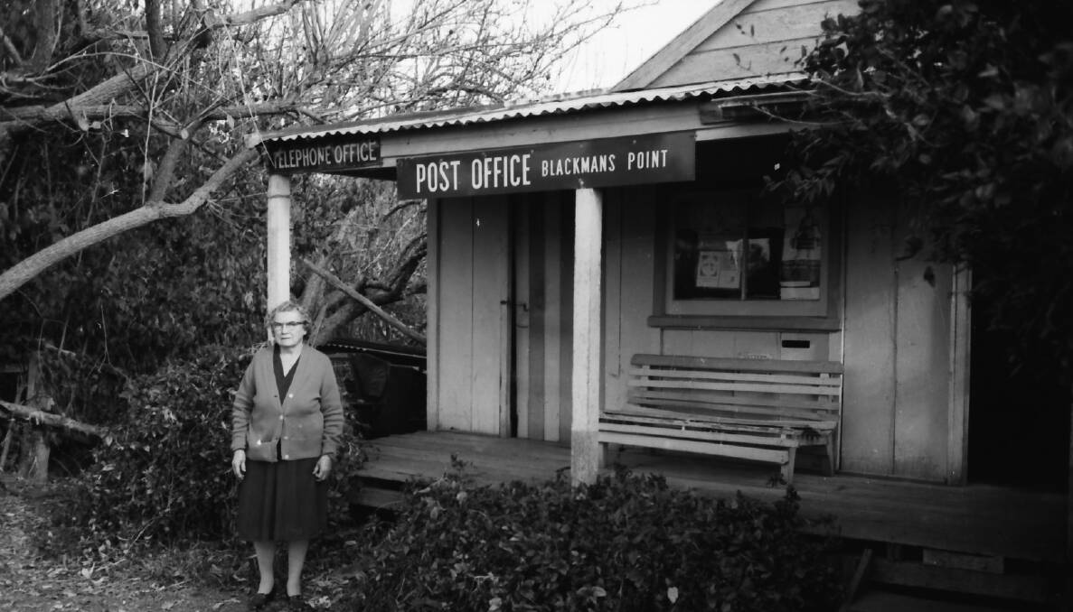 Too lonely: Mrs Gardiner outside the Blackmans Point Post Office on the day it closed, 1970. Photo: Supplied
