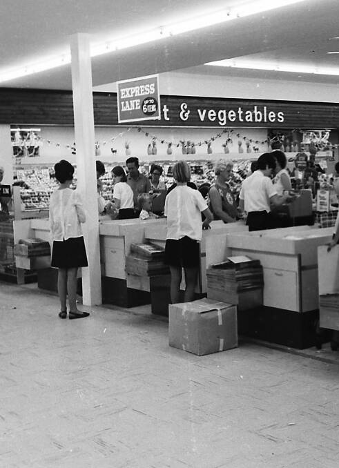 Run off their feet: Woolworth’s staff at the modern new checkouts were exceptionally busy during the first week of trading at the Plaza store, 1968. Photo supplied