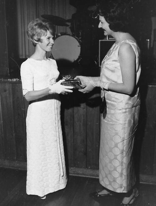 Love the look: Jennifer Hennessey accepts her prize for the best dressed lady at the Legacy Ball, 1968.