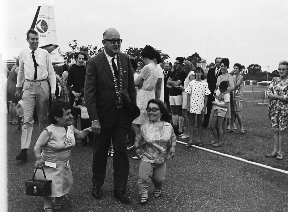 Glad you are here: Mayor Alderman C.C. Adams welcomes the smallest mother in Australia, Jean Ryan, and her daughter Lynne, to Port Macquarie, 1968.