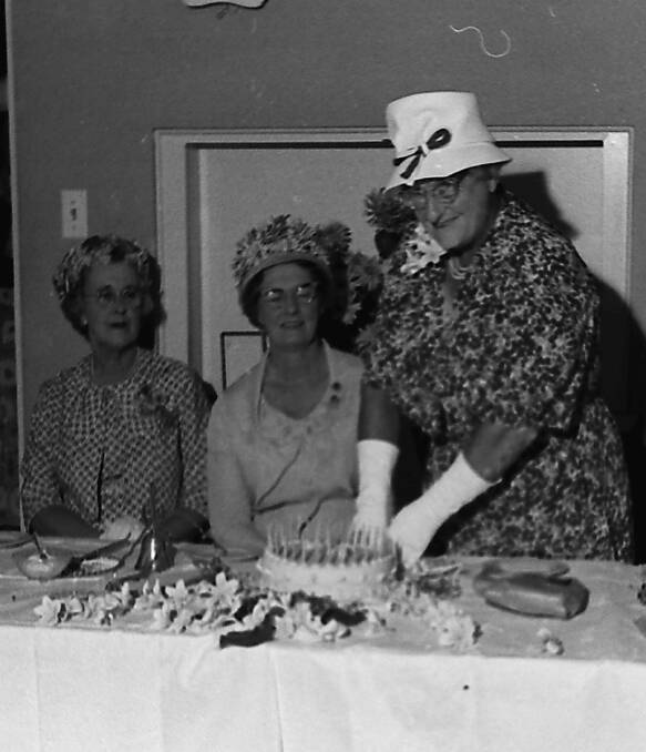 Milestone: Mrs Vi McLaren patroness of the CWA, cut the birthday cake, at celebrations in 1963. Photos supplied by Port Macquarie Museum.
