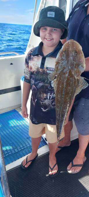 Score: Riley from Narrabri recently had a great day offshore with Fish Port Macquarie Charters, scoring this sensational 60 centimetre sand flathead.