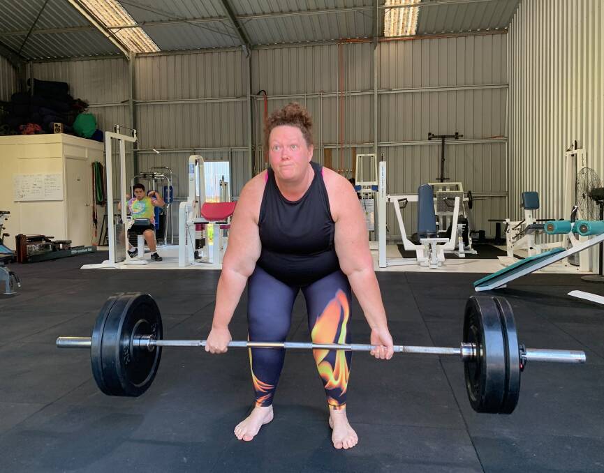 Di Cook warming up with an 85kg deadlift