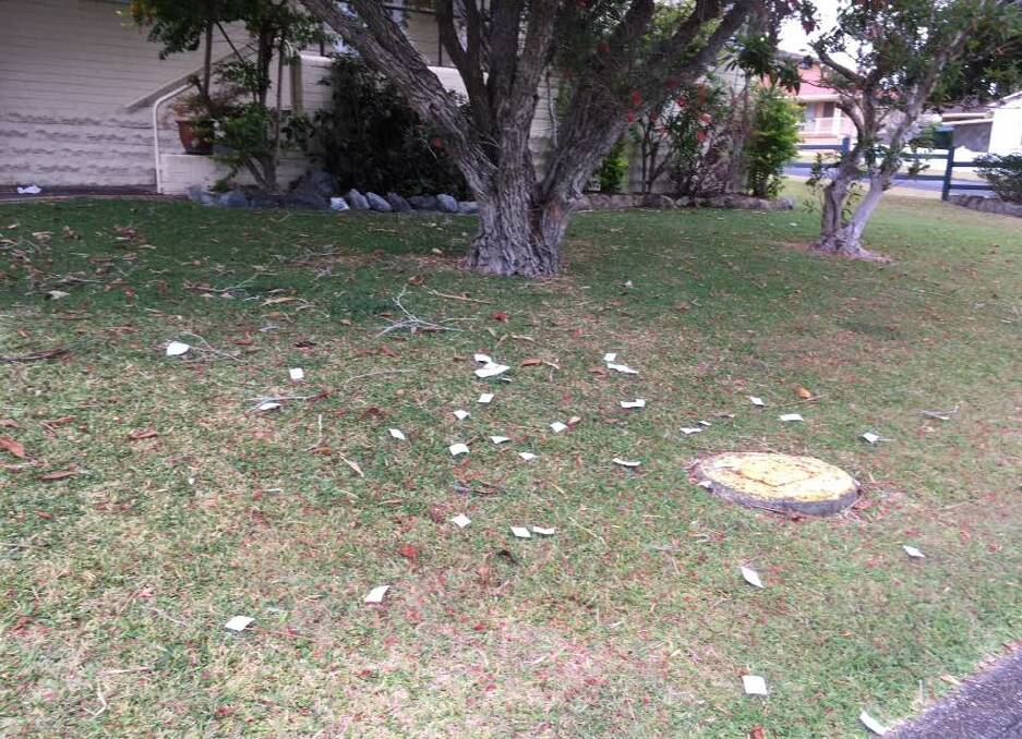 LOW ACT: Vandals scattered the lawn with over 200 squares of paper with  'vote no' scrawled over it. Photo: Contributed.