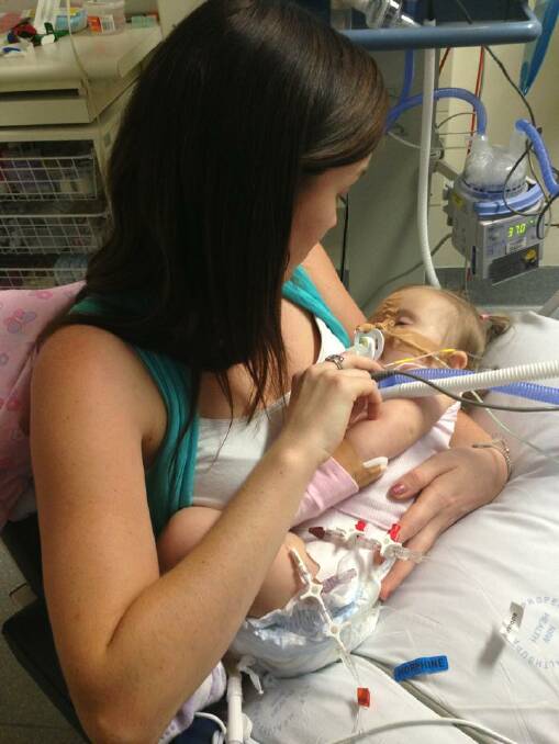 LOVE: Cailtlin with Kylah during one of her many hospital visits. 