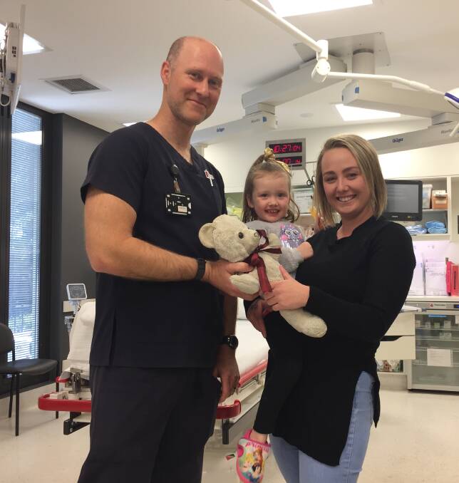 REUNITED: Dannielle McLaughlin and Charlee-May Ashburn were reunited with Teddy thanks to Andrew Baxter Port Macquarie Base Hospital's emergency clinical nursing unit manager. Photo: Laura Telford.