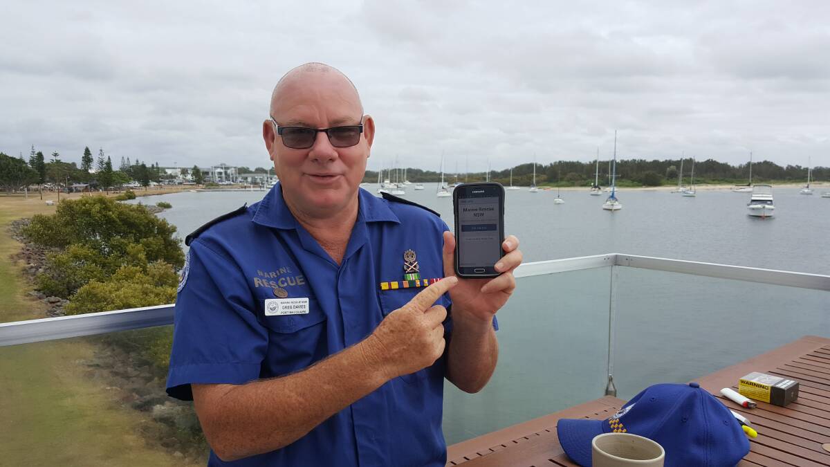 SIGN ON: Unit commander Greg Davies with the easy to use Marine Rescue app to log on. Photo: Laura Telford.