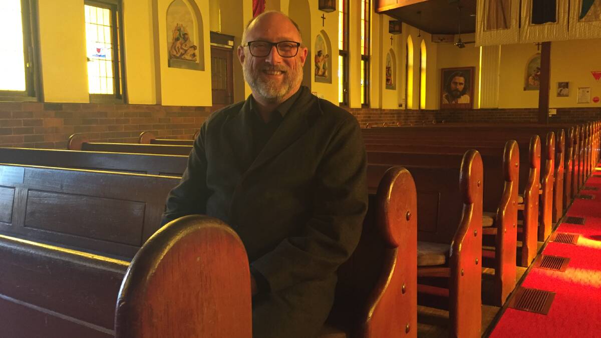 HOME: Father Paul Gooley in the Catholic Church on Hay Street, Port Macquarie. Photo: Laura Telford.