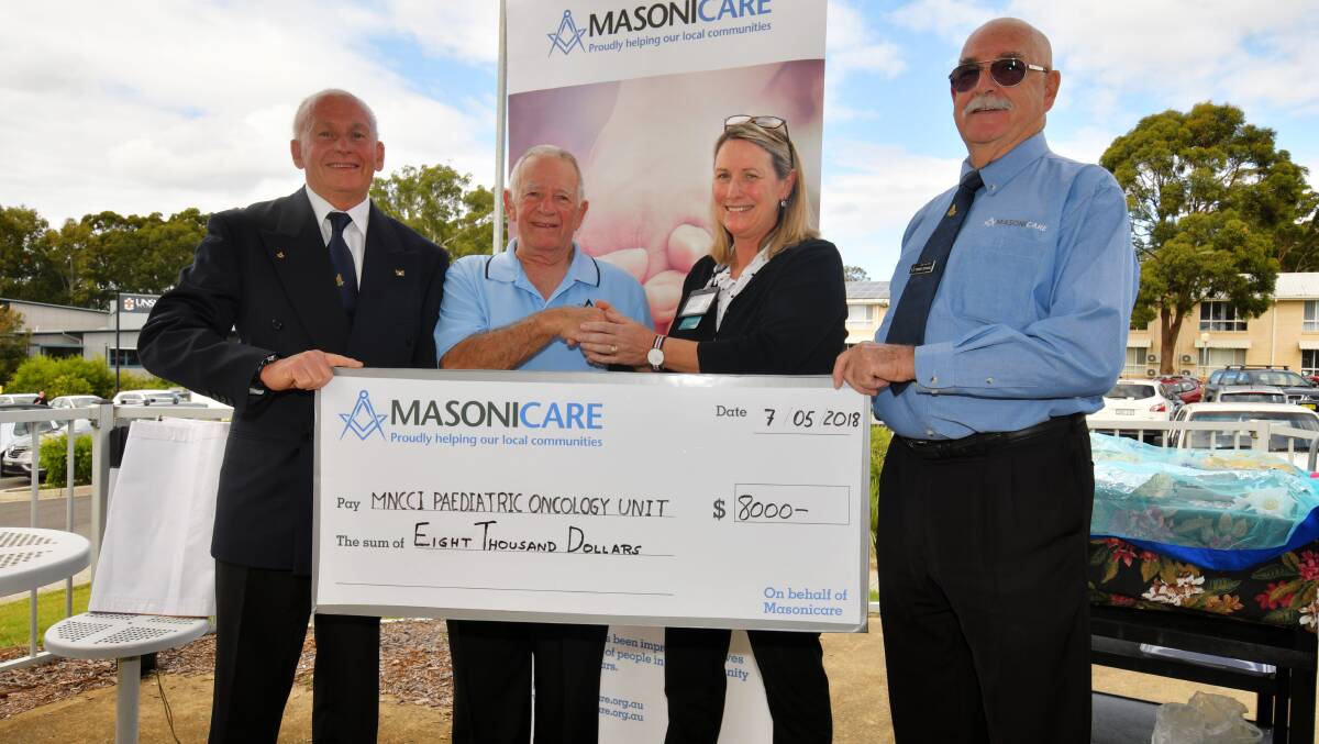 HELPING HAND: Freemasons district grand inspector of workings, Wayne Broome, Ray Posner of the Lodge Star of Wauchope, acting nursing and service development manager, Jill Harrington, region Masonicare manager, Robert Drysdale. Photo: Ivan Sajko.