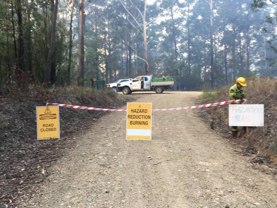 BE SAFE: Forestry Corporation staff installing Road Closures in Bulls Ground State Forest, near Herons Creek.