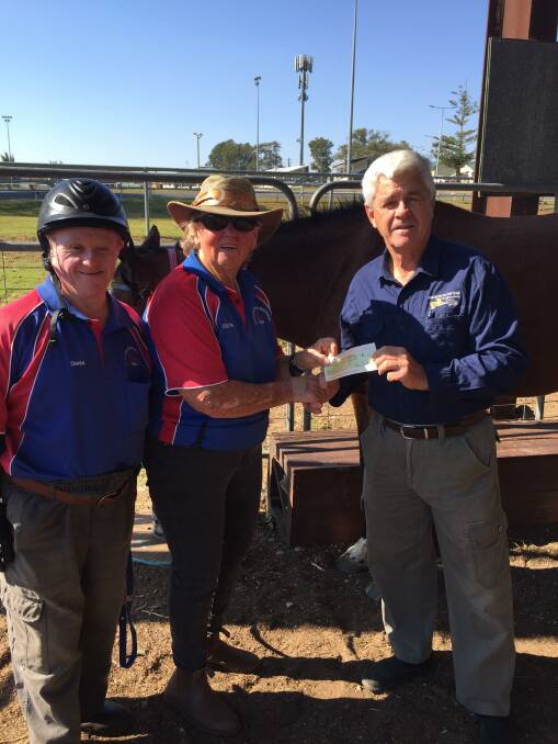 GREAT WORK: Secretary Greg Cavanagh presenting a cheque to Robyn Coombes, Coach at Riding for Disabled Wauchope with Senior Rider Dennis McCarthy.