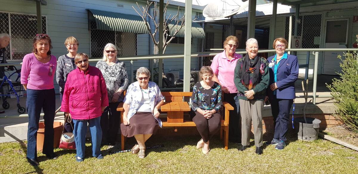 HELPING HAND: Volunteers Jenna Wood, Regional Representative Dee Hunter, Debbie Garrett, Win Secombe, Margaret Mostyn, Judy Allan, Carol Peters and WDMH Nursing Administration Manager Judy Beilby with one of the Jack and Jill seats donated by the group.