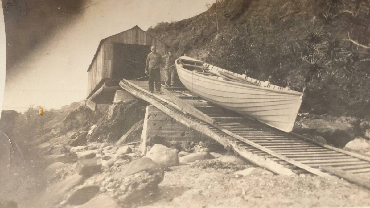 Tom and Arthur with their boat on the ramp in 1950. A boat shed was built on top
of high rocks 600 yards east of Bartlettss Beach. Photo: Bartlett family. 