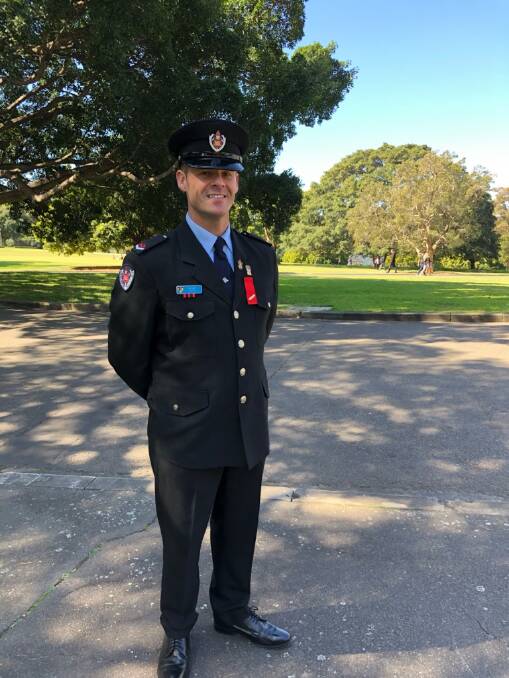 DECORATED: Firefighter Ben Swift with his Commendation for Brave Conduct awarded in Sydney. Picture: Supplied