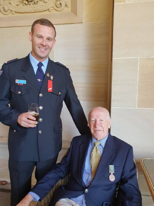 AWARDED: Ben Swift with his grandfather Brian Swift from Wauchope after the investiture ceremony in Sydney. Picture: Supplied
