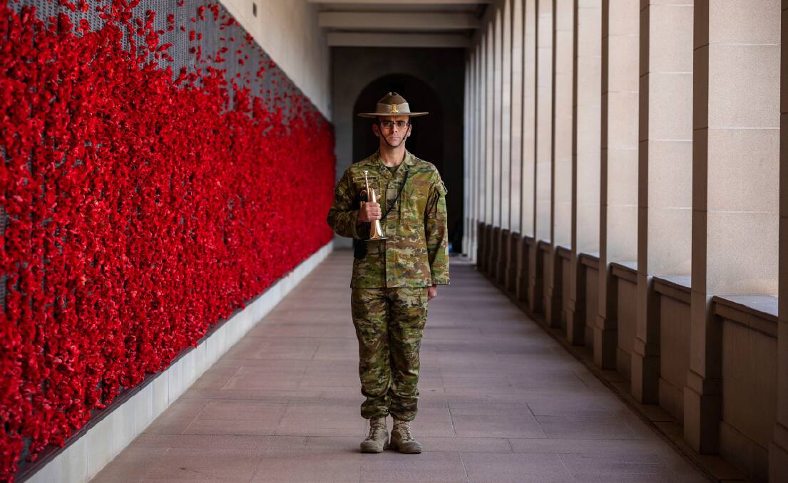Australian Army Sergeant James Duquemin stands-fast with his bugle at the Australian War Memorial on 21 April 2020.