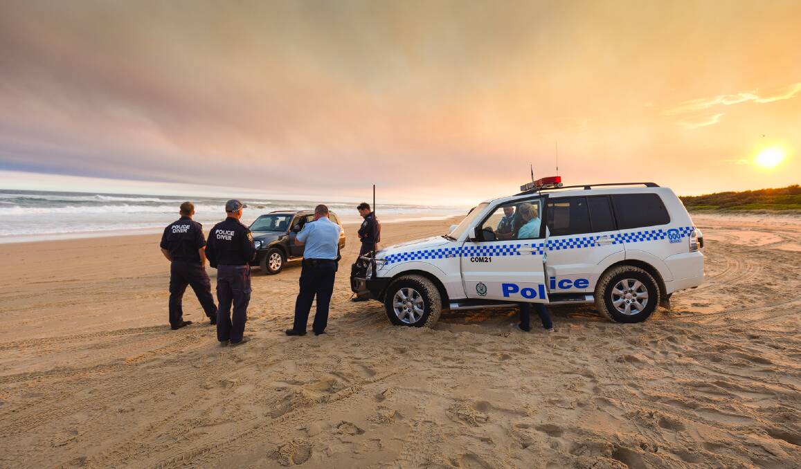 Search continues: Emergency services crews search for an 11-year-old boy feared drowned at Lighthouse Beach. Photo: Ivan Sajko
