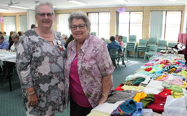Port Pink Ladies President Gabby Gregory and Wauchope Hospital Volunteers President Win Secombe at the trading table.