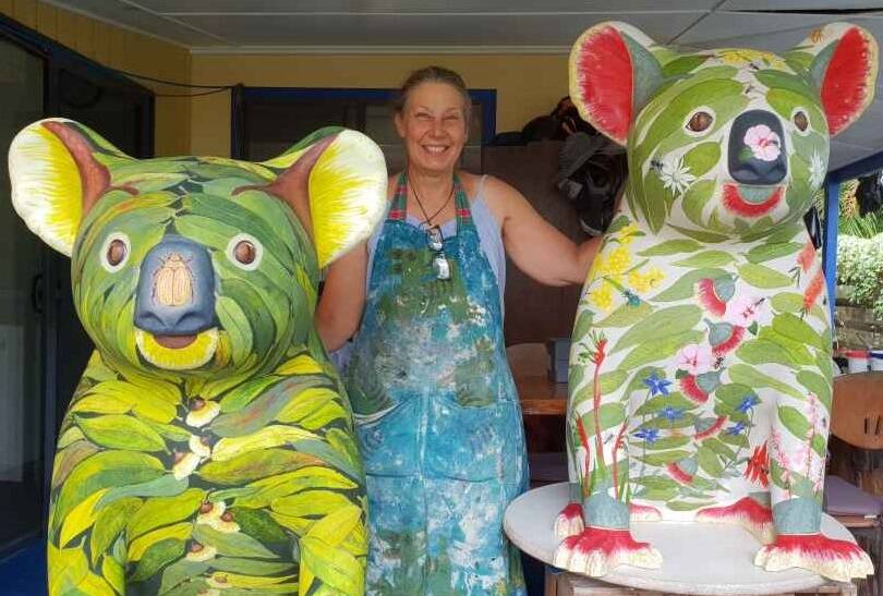 Artist Lisa Burrell with two of her Hello Koalas, the original much-loved Bushby which is joining the Hello Koalas touring exhibit and Buzzy Bee, which made a hit in Canberra but has not been seen yet in Port Macquarie.