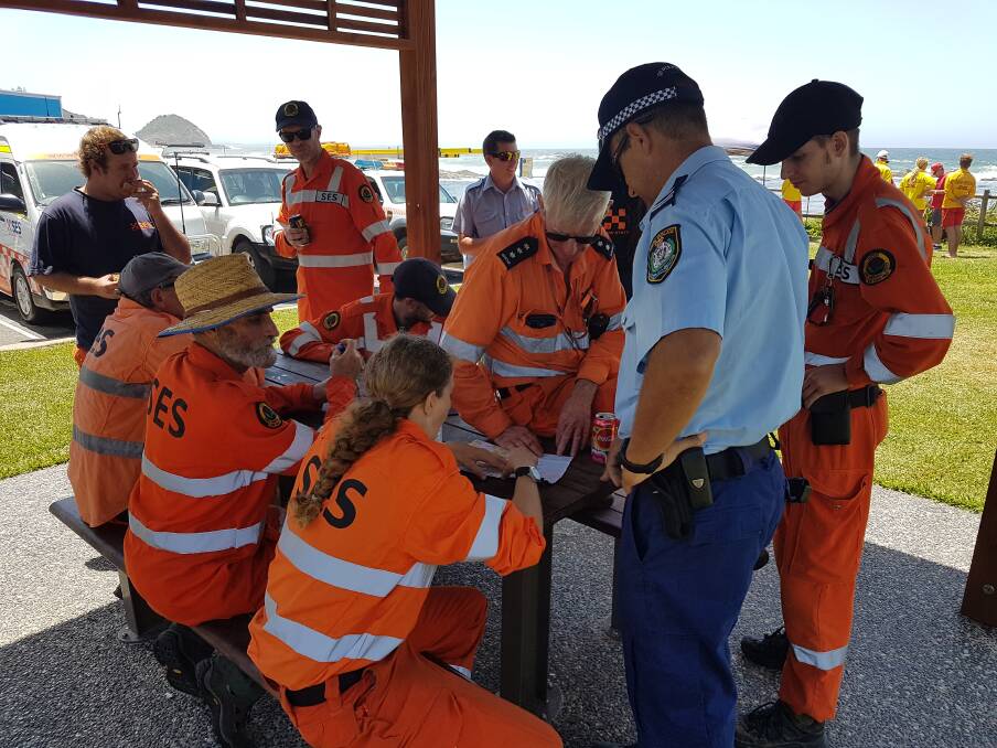 Search: SES and Police discussing where to search for the two missing men.