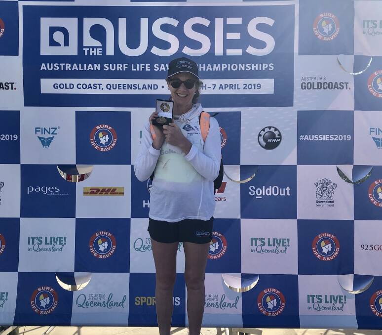 CHAMPION: Elaine Walker with a bronze medal for the womens masters 45-49 yrs single ski at Aussies in 2019. Photo: Supplied/Elaine Walker.