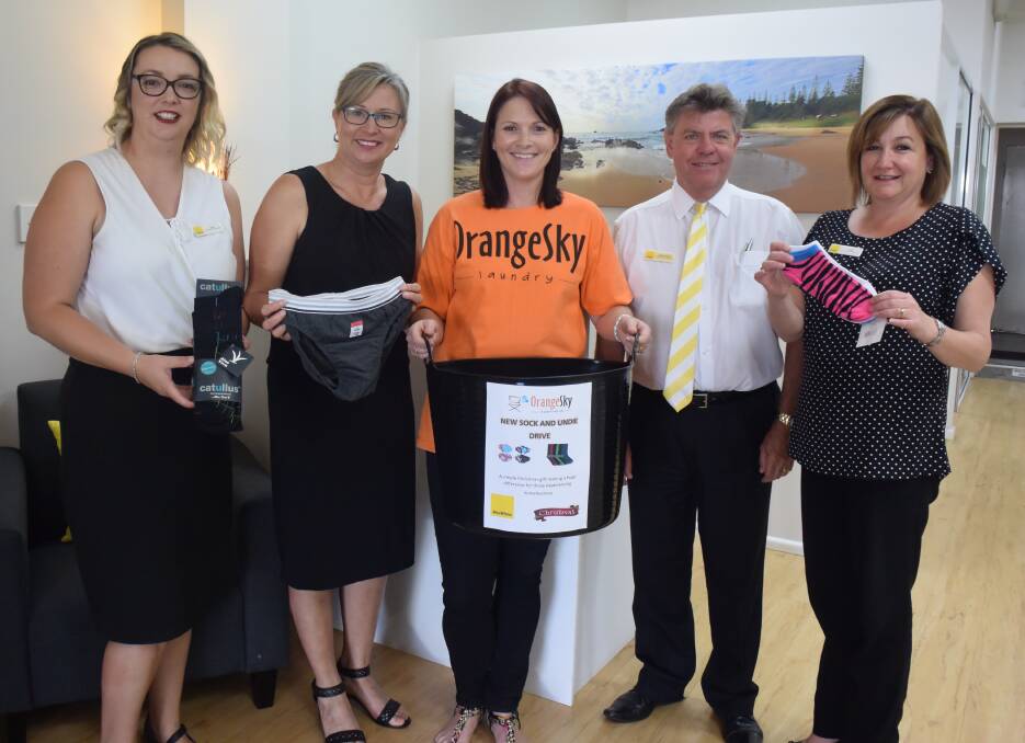 Donations wanted: Ray White Port Macquarie property managers Lisa Lewis and Nicole Prince, Orange Sky Australia service manager Alison Neale, Ray White Port Macquarie principal Mark Carter and property manager Jodi McGuinness support the undie and sock drive.