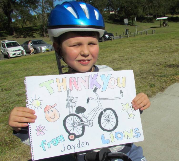 TAD client Jayden Stainforth displays the thank you poster.