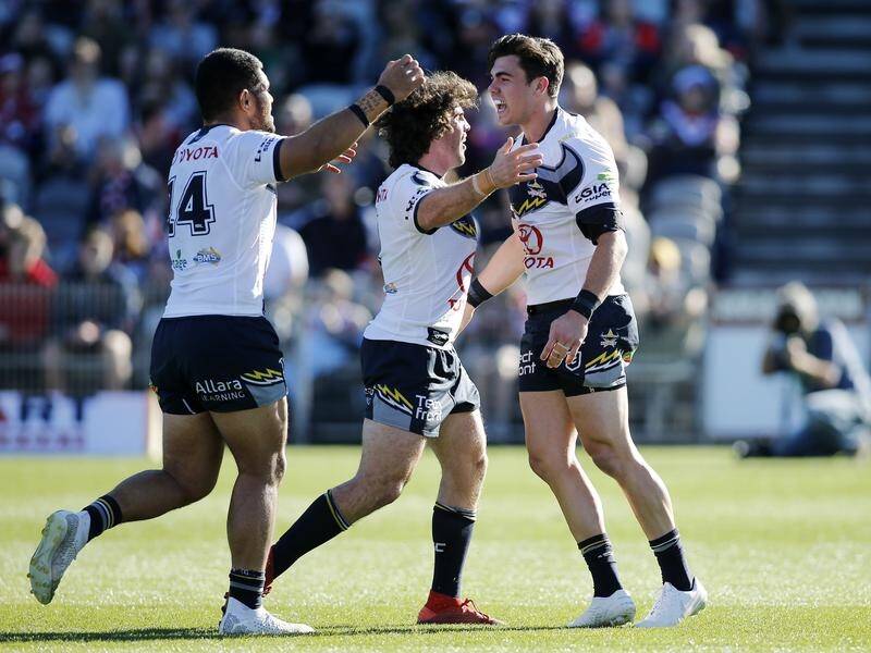 Jake Clifford (R) has starred at halfback in North Queensland's NRL upset of the Sydney Roosters.