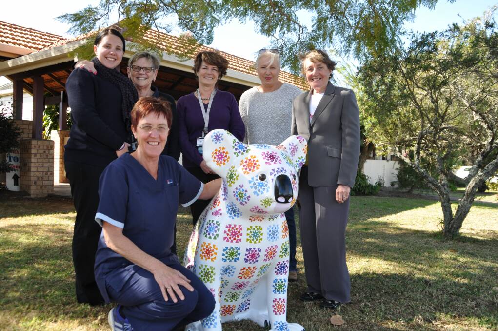 Symbolic: Wauchope District Memorial Hospital staff members Karen Woollard, front, Denni Bartlett, Maureen O'Connor and Ann Bodill, and Hello Koalas organisers Linda Hall and Margaret Meagher, with the new "Grannny Square" koala to be located at the hospital.