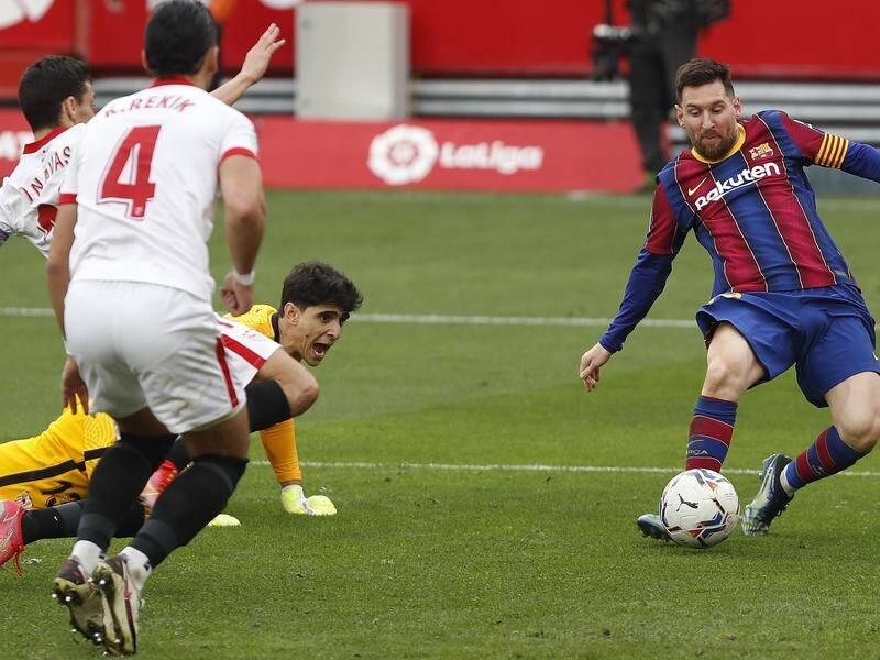 Lionel Messi notches his 19th goal of the season to seal Barcelona's 2-0 win at Sevilla.