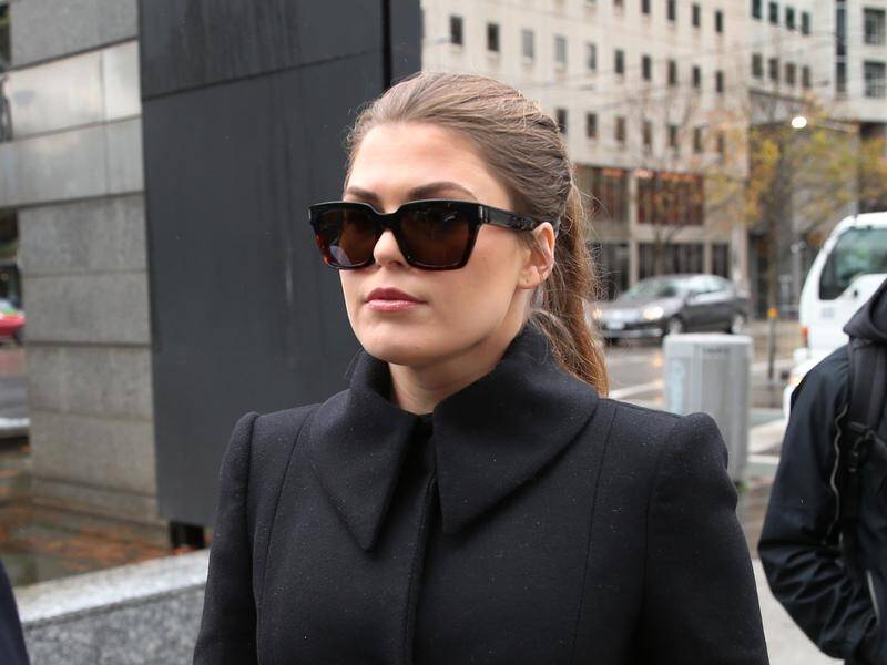 The home of cancer con artist Belle Gibson has been raided in an effort to recoup a $500,000 fine.