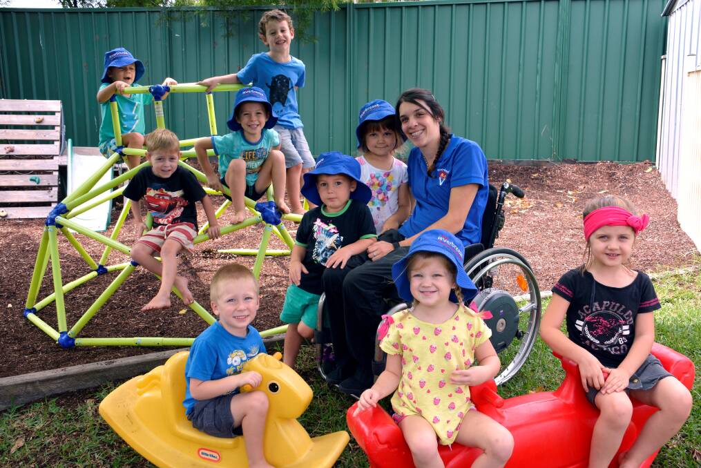 The apple of their eyes: Rosie Attard is clearly adored by toddlers at Wauchope's Riverbreeze Preschool and Childcare Centre. She's pictured here with (back) Miller Farrington, Callum Williamson, Billy Nowlan, Angus McKay and (front) Kaiden Ostler, Tyson Wheatley, Zara Smith, Macy Knox and Lacey Gayler.