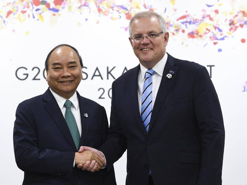 Scott Morrison (R) will visit Vietnam in the first visit by an Australian prime minister in 25 years